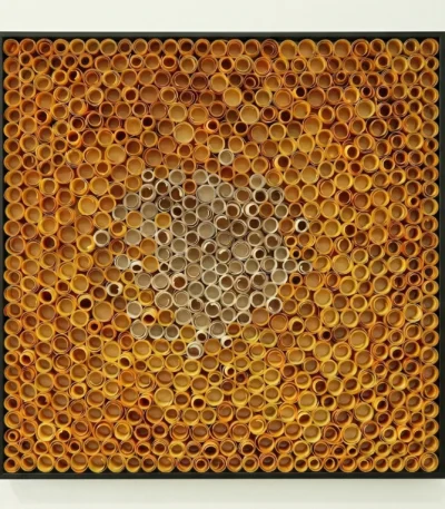 Textured abstract hand-painted canvas with concentric circles in golden amber and neutral taupe tones