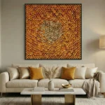 Textured abstract hand-painted canvas in warm golden and cream tones with layered dimensional circles, contemporary living space