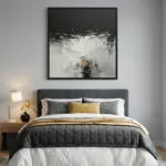 Contemporary abstract hand-painted canvas in gestural black, white and gold tones, modern bedroom