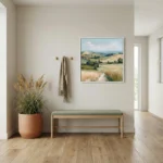 Impressionist landscape hand-painted canvas depicting rolling hills, golden fields, and cypress trees in soft blues and warm earth tones, contemporary entryway