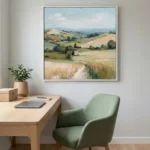 Impressionist landscape hand-painted canvas depicting rolling Tuscan hills, golden fields, and cypress trees in warm earth and soft green tones, contemporary workspace
