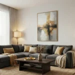 Abstract hand-painted canvas with layered golden and charcoal brushstrokes, muted neutral palette, contemporary living space