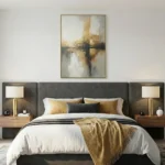 Layered abstract hand-painted canvas depicting an architectural reflection in muted golds, greys and cream tones, modern bedroom
