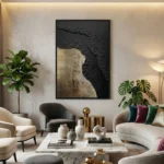 Textured abstract hand-painted canvas in charcoal black and warm gold tones, contemporary living space