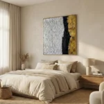 Textured abstract hand-painted canvas in white, black, and gold leaf with layered gestural brushstrokes, modern bedroom
