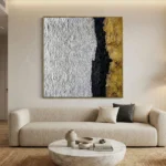 Textured abstract hand-painted canvas with white, black, and gold leaf vertical color blocking, contemporary living space