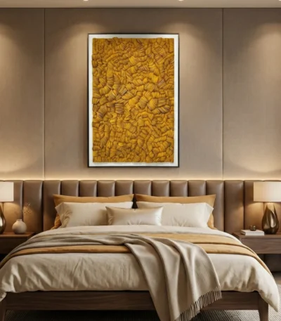 Textured abstract hand-painted canvas in golden ochre and warm amber tones, modern bedroom setting