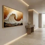 Textured abstract hand-painted canvas depicting a dynamic wave in cream and bronze tones, contemporary hallway setting