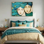 Contemporary figurative hand-painted canvas depicting two serene faces with flowing teal and gold hair, styled bedroom setting