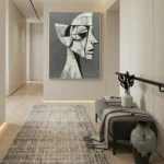 Abstract figurative hand-painted canvas depicting geometric profile head in monochrome grays and whites, modern entryway