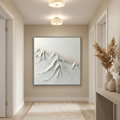 Textured monochrome hand-painted canvas depicting snow-capped mountain peaks in layered white and gray tones, contemporary entryway