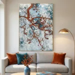 Textured abstract hand-painted canvas with rust and teal river patterns over white, contemporary living space