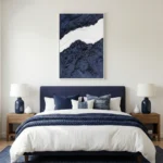 Textured abstract hand-painted canvas with layered navy and cream tones, minimalist composition, modern bedroom