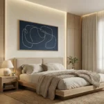 Minimalist hand-painted canvas with flowing white line gestures on deep navy, modern bedroom setting
