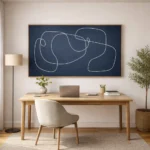 Minimalist hand-painted canvas with flowing white line abstractions on deep navy, modern home office