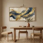 Abstract hand-painted canvas with flowing navy and gold leaf strokes on cream, contemporary dining space