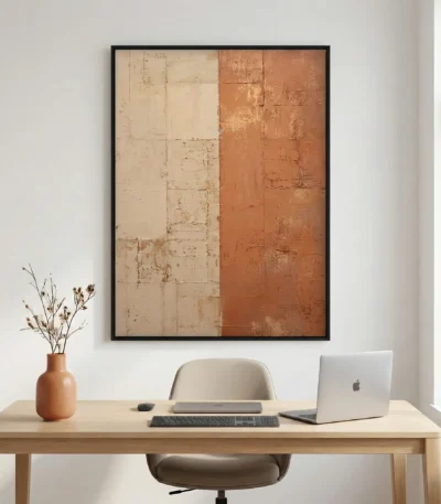 Abstract hand-painted canvas with divided composition in cream and terracotta tones, textured brushwork, modern workspace