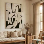 Abstract hand-painted canvas in bold black and cream geometric shapes, contemporary living space