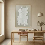 Textured abstract hand-painted canvas with white dimensional forms and linear elements on soft gray, dining space setting