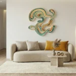Gestural abstract hand-painted canvas with flowing organic shapes in teal, ochre, and cream tones, contemporary living space