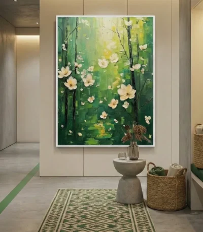 Layered abstract hand-painted canvas depicting cream flowers and dark branches against vibrant green tones, contemporary entryway