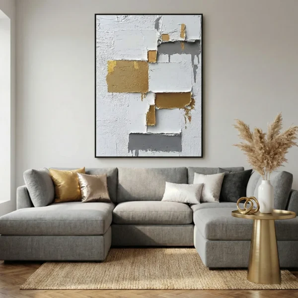 Textured abstract hand-painted canvas with layered gold, charcoal, and cream geometric blocks, contemporary living space