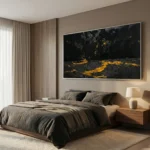 Textured abstract hand-painted canvas depicting molten lava flows in black and gold, modern bedroom setting