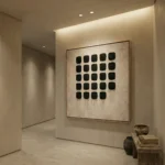 Minimalist hand-painted canvas featuring grid of black rounded squares with gestural drip details in cream and charcoal, contemporary entryway