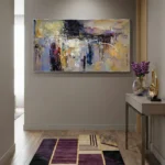 Layered abstract expressionist hand-painted canvas in muted purples, golds, and blacks with gestural white markings, contemporary entryway