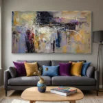 Gestural abstract expressionist hand-painted canvas with layered yellows, purples, and blacks, contemporary living space