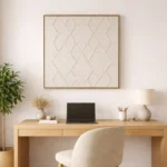 Textured minimalist hand-painted canvas featuring geometric diamond patterns in cream and taupe tones, contemporary workspace