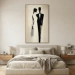 Minimalist figurative hand-painted canvas depicting two silhouetted figures in monochrome black and grey, contemporary bedroom setting