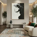 Minimalist monochrome hand-painted canvas depicting a woman's profile in bold black and white gestural strokes, contemporary living space
