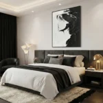 Monochromatic figurative hand-painted canvas depicting a woman's profile in bold black and white contrast, contemporary bedroom setting