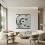 Abstract hand-painted canvas with gestural black and white swirling brushstrokes and circular forms, monochrome palette, contemporary living space