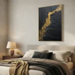 Textured abstract hand-painted canvas with dramatic black and gold leaf composition, modern bedroom