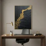 Contemporary textured hand-painted canvas with dramatic black and gold leaf abstract design, modern workspace
