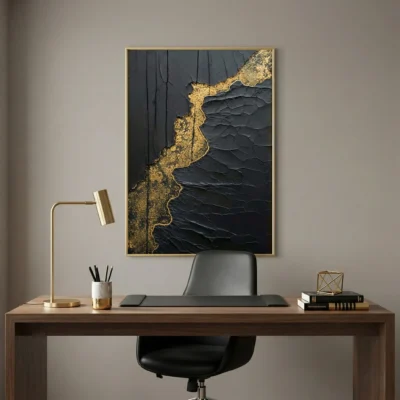 Contemporary textured hand-painted canvas with dramatic black and gold leaf abstract design, modern workspace