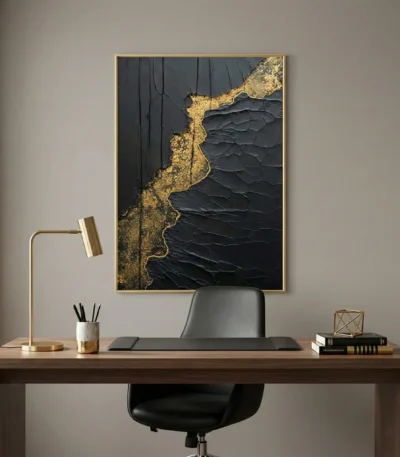 Contemporary textured hand-painted canvas with dramatic black and gold leaf abstract design, modern workspace