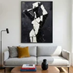 Contemporary abstract hand-painted canvas depicting a stylized figure in bold black and white gestural strokes, modern living space