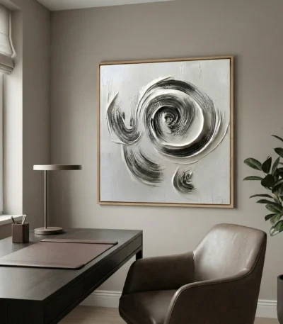 Gestural abstract hand-painted canvas with dynamic circular brushstrokes in monochrome black and white, contemporary office space