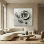 Gestural abstract hand-painted canvas with dynamic spiral and curved brushstrokes in charcoal and cream tones, contemporary living space