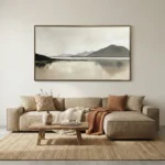 Minimalist landscape hand-painted canvas depicting misty mountain and still water in muted grey and cream tones, contemporary living space