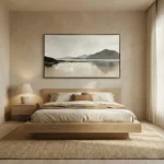 Minimalist landscape hand-painted canvas depicting misty mountains and still water in muted grays and beiges, modern bedroom