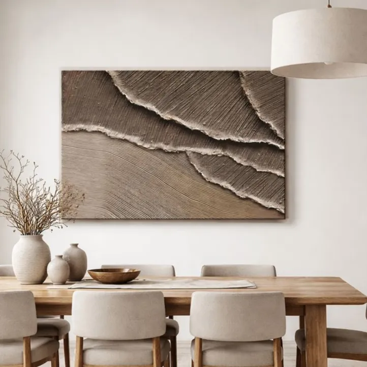 Textured abstract hand-painted canvas with layered cream and taupe brushstrokes suggesting ocean waves, contemporary dining space