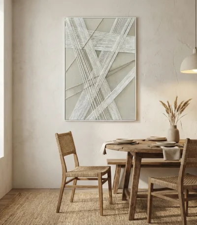 Minimalist abstract hand-painted canvas with interwoven linear patterns in soft grey and cream tones, contemporary dining space