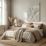 Contemporary abstract hand-painted canvas with interlocking linear patterns in cream and grey tones, modern bedroom