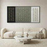 Minimalist hand-painted canvas with geometric dot grid pattern in monochrome tones, contemporary living space