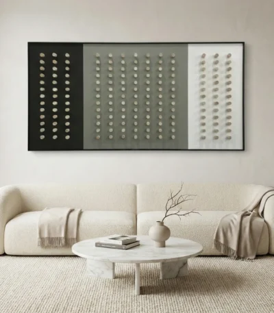 Minimalist hand-painted canvas with geometric dot grid pattern in monochrome tones, contemporary living space