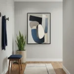Minimalist abstract hand-painted canvas in navy, cream, and taupe geometric shapes, contemporary entryway